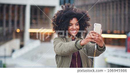 Black woman, city and selfie with afro, phone or smile for social media profile picture. Happy gen z girl, influencer or smartphone for blog, post or networking app on rooftop balcony for travel 106945986