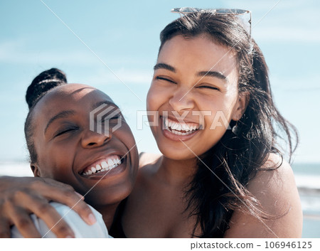 Woman, friends and hug with smile for beach day, summer vacation or travel together outdoors. Portrait of happy women laughing in joy for friendship, travel or fun holiday bonding by the ocean coast Woman, friends and hug with smile for beach day, summer vacation or travel together outdoors. Portrait of happy women laughing in joy for friendship, travel or fun holiday bonding by the ocean coast 106946125