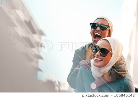 Muslim women, friends and piggyback in city with mockup space, travel and comic adventure together. Islamic woman, happiness and walking in metro cbd with funny game, sunglasses and bond on journey Muslim women, friends and piggyback in city with mockup space, travel and comic adventure together. Islamic woman, happiness and walking in metro cbd with funny game, sunglasses and bond on journey 106946148