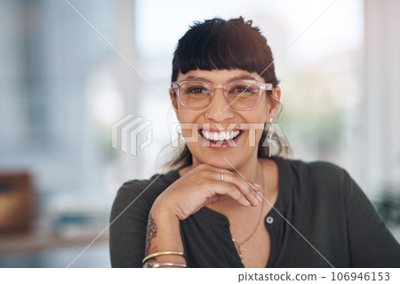 This is the smile of success. Cropped portrait of an attractive young businesswoman sitting alone in her office with her hand on her chin. This is the smile of success. Cropped portrait of an attractive young businesswoman sitting alone in her office with her hand on her chin. 106946153