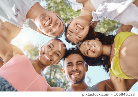 Diversity, group huddle for teamwork and happy together outside with a lens flare. Portrait or support, community or motivation and face of friends smile for summer holiday or vacation outdoors Diversity, group huddle for teamwork and happy together outside with a lens flare. Portrait or support, community or motivation and face of friends smile for summer holiday or vacation outdoors 106946158