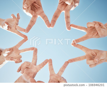 Hands, star and blue sky, support and solidarity with team huddle, community and V sign with connection. Social, goals and mission with group of people outdoor, cooperation and synergy with low angle 106946201