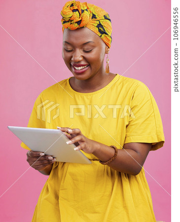 Black woman, tablet and communication, app and social media with chat, internet search and wireless in studio. Scroll online with smile, African user with tech and touchscreen on pink background Black woman, tablet and communication, app and social media with chat, internet search and wireless in studio. Scroll online with smile, African user with tech and touchscreen on pink background 106946556