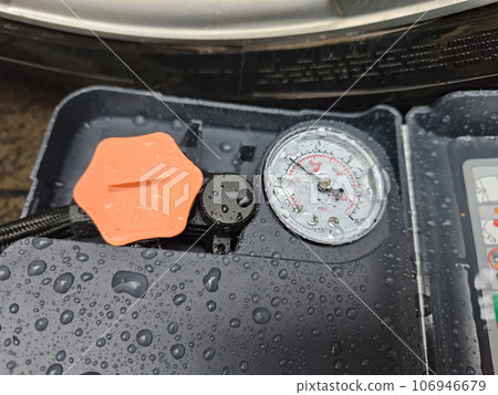On a wet asphalt road pump due to a flat tire On a wet asphalt road pump due to a flat tire 106946679
