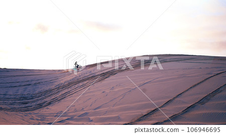 Hill, desert mockup or athlete on motorcycle for action, adventure or fitness with wellness or space. Sunset, sand or sports driver on motorbike on dunes in training, exercise or race challenge Hill, desert mockup or athlete on motorcycle for action, adventure or fitness with wellness or space. Sunset, sand or sports driver on motorbike on dunes in training, exercise or race challenge 106946695