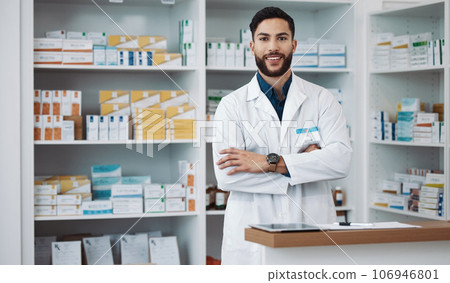 Pharmacist, man and arms crossed with medicine, portrait and confident with trust, healthcare and happiness. Face, Latino male and employee with smile, pharmacy and wellness in store and happy expert Pharmacist, man and arms crossed with medicine, portrait and confident with trust, healthcare and happiness. Face, Latino male and employee with smile, pharmacy and wellness in store and happy expert 106946801