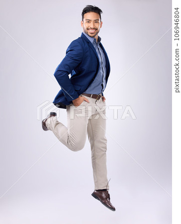 Jump, happy and portrait of man in studio with positive mindset, happiness and joy on white background. Winner, success mockup and isolated male jumping with smile for energy, freedom and confidence 106946804