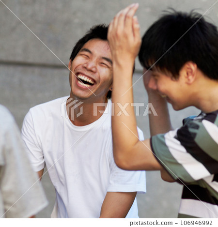 Friends, laughing and portrait of asian teenager with happiness, freedom and funny conversation on weekend or holiday. Joke, comedy and smile on face of Japanese teen boy or college student in group Friends, laughing and portrait of asian teenager with happiness, freedom and funny conversation on weekend or holiday. Joke, comedy and smile on face of Japanese teen boy or college student in group 106946992