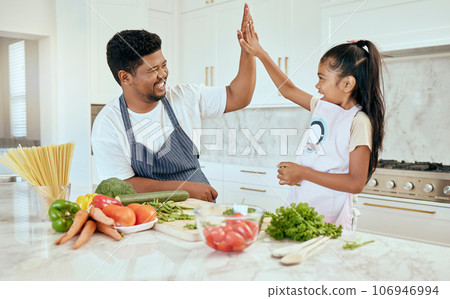 Food, family and high five with girl and father in a kitchen preparing a meal, bonding and having fun in their home. Love, kids and parent help, trust and support while cooking a balanced dinner Food, family and high five with girl and father in a kitchen preparing a meal, bonding and having fun in their home. Love, kids and parent help, trust and support while cooking a balanced dinner 106946994