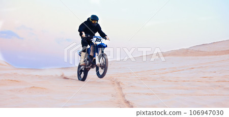 Sand, desert or athlete driving motorcycle for action, adventure or fitness with performance or adrenaline. Rally, sports or person on motorbike on dunes for training, exercise or race or challenge 106947030
