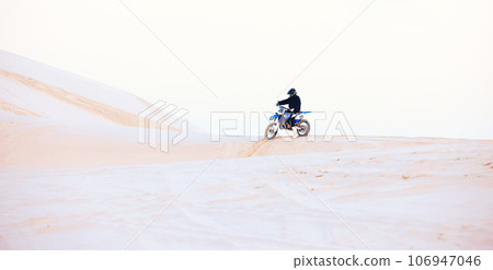 Desert, hill or athlete driving motorcycle for action, adventure or fitness with performance or adrenaline. Sand, sports or person on dirt motorbike on dunes for training, exercise or race challenge 106947046
