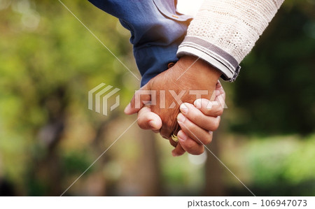 Love, closeup senior couple holding hands and in a park nature background. Support or care, bonding or quality time and married old people outdoors together in a garden or in green environment. 106947073