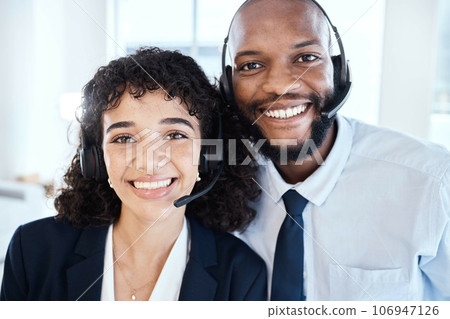 Happy, portrait and customer service consultants in the office working on a crm consultation online. Happiness, smile and interracial telemarketing colleagues taking a picture together in workplace. Happy, portrait and customer service consultants in the office working on a crm consultation online. Happiness, smile and interracial telemarketing colleagues taking a picture together in workplace. 106947126