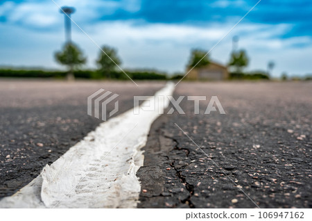 fabric coving on top of an asphalt crack repair  106947162