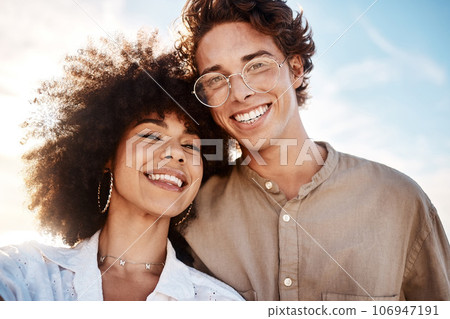 Portrait of a young mixed race couple enjoying a day at the beach looking happy and in love. Portrait of a young mixed race couple enjoying a day at the beach looking happy and in love. Portrait of a young mixed race couple enjoying a day at the beach looking happy and in love. Portrait of a young mixed race couple enjoying a day at the beach looking happy and in love. 106947191