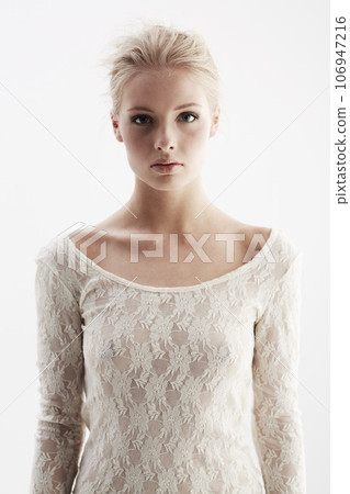 Portrait, feminine and lace with an elegant woman in studio on a white background for beauty or makeup. Serious, cosmetics or confident with an attractive young female model posing in lacy underwear Portrait, feminine and lace with an elegant woman in studio on a white background for beauty or makeup. Serious, cosmetics or confident with an attractive young female model posing in lacy underwear 106947216