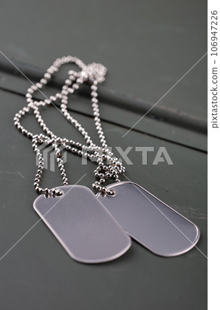 US army dog tags on green ammo can 106947226