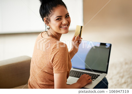 Woman with smile, laptop and credit card with online shopping and payment on store website with fintech. Young female person at home, portrait and happy with internet banking, finance and ecommerce 106947319