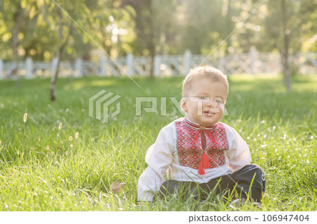 Toddler boy in Ukrainian vyshyvanka in summer. . Toddler boy in Ukrainian vyshyvanka in summer. . 106947404