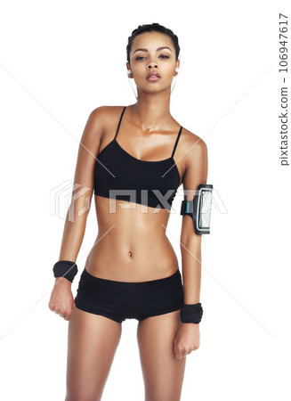 Music, fitness and sports with woman and phone for workout, health and cardio training. Podcast, mobile radio and motivation with isolated girl listening to earphones for exercise, streaming and goal Music, fitness and sports with woman and phone for workout, health and cardio training. Podcast, mobile radio and motivation with isolated girl listening to earphones for exercise, streaming and goal 106947617