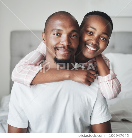 Portrait, love and black couple in bedroom, smile and romance for Valentines day, affection and hug. Romantic, man and woman embrace on bed, loving and bonding on weekend break and relax together Portrait, love and black couple in bedroom, smile and romance for Valentines day, affection and hug. Romantic, man and woman embrace on bed, loving and bonding on weekend break and relax together 106947645