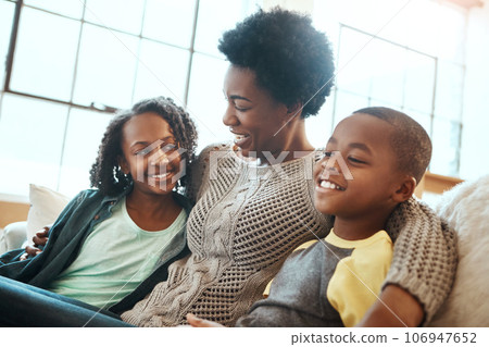Love, mother and children relax sofa for happy family time together in apartment in South Africa on weekend. Smile trust and support, black woman and kids sitting on couch with healthy relationship. Love, mother and children relax sofa for happy family time together in apartment in South Africa on weekend. Smile trust and support, black woman and kids sitting on couch with healthy relationship. 106947652