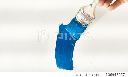 brush with blue paint on a white background brush with blue paint on a white background 106947657