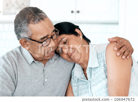 Ill always have a shoulder for you to lean on. Shot of a senior couple looking unhappy at home. Ill always have a shoulder for you to lean on. Shot of a senior couple looking unhappy at home. 106947672