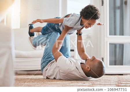 Kid, father and plane game on floor with smile, bonding and love in living room, family home and care. Man, body child and together for playing, airplane and excited on carpet in lounge with lifting 106947731