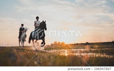 Horse riding, friends and girls in countryside at sunset with outdoor mockup space. Equestrian, happy women and animals in water, nature and adventure to travel, journey and summer vacation together. 106947807
