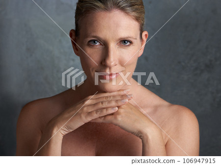Mature woman, skincare and portrait with natural beauty pride or cosmetic dermatology makeup. Isolated, gray background and female person face with facial wellness, self care and anti aging cosmetics 106947915