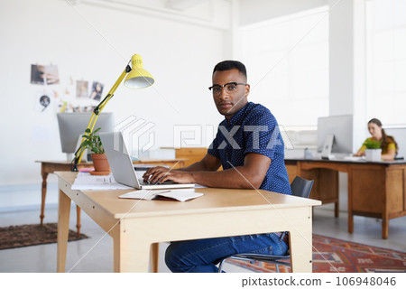 Journalist, portrait or serious black man typing on laptop working on email, business project or online research. Computer, digital or focused worker copywriting on blog, reports or internet article 106948046