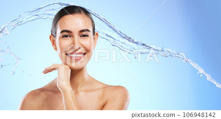 Water splash, skincare portrait or happy woman with smile or smiling female model face on studio background. Dermatology cosmetics or beautiful girl with facial treatment, beauty or glowing results Water splash, skincare portrait or happy woman with smile or smiling female model face on studio background. Dermatology cosmetics or beautiful girl with facial treatment, beauty or glowing results 106948142