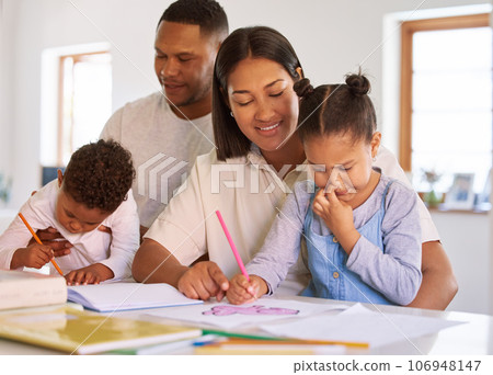 Family, parents help their children with homework and books on desk at their home. Support with writing or reading, education or learning and woman with man helping their kids color in a book 106948147
