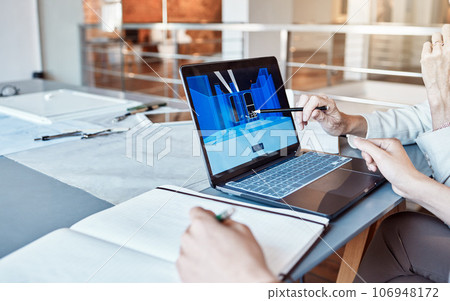 Architect, design engineer or contractor pointing to a 3d digital model on a laptop screen, discussing a plan or idea with a colleague in a meeting. Business people talking about a work project 106948172