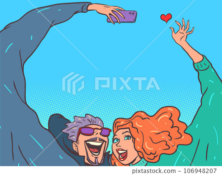 Romantic relationship between spouses. Honeymoon abroad together. A man and a girl next to each other take a selfie and show a heart. 106948207