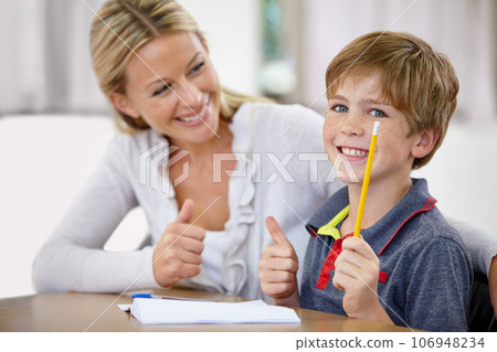 Portrait, child and teacher with thumbs up in classroom, smile and pencil. Happiness, educator and student with hand gesture for like emoji, agreement and learning in elementary school for education. 106948234