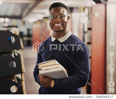 Student, university and portrait of black man in library for learning, education and reading books. Academy, college and happy African person with textbooks for research, school project and studying Student, university and portrait of black man in library for learning, education and reading books. Academy, college and happy African person with textbooks for research, school project and studying 106948327