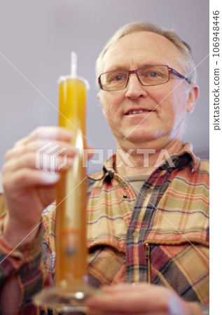 Beer, brewing and glass tube with a man in a plant, factory or warehouse for the production of alcohol. Manufacturing, industry and career with a male brewer in a distillery for quality control Beer, brewing and glass tube with a man in a plant, factory or warehouse for the production of alcohol. Manufacturing, industry and career with a male brewer in a distillery for quality control 106948446