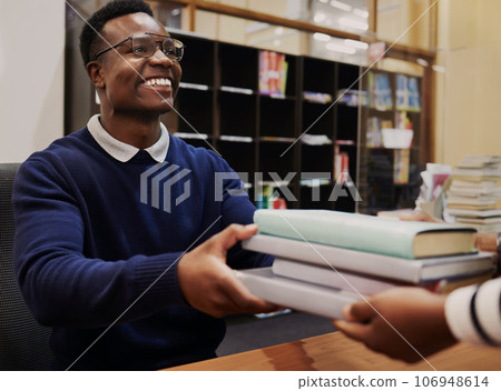 Librarian man, reception desk and books with smile, learning or hands for care, knowledge or administration. People, library employee or secretary for study, info or staff for education at university 106948614