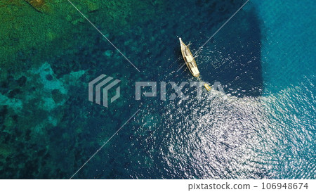 Aerial, yacht and sailing in water, summer on ocean holiday and relax in freedom with nature from above. Boat vacation, travel in Croatia and tropical cruise on sea adventure to island in mockup. Aerial, yacht and sailing in water, summer on ocean holiday and relax in freedom with nature from above. Boat vacation, travel in Croatia and tropical cruise on sea adventure to island in mockup. 106948674