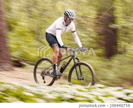 Nature, bicycle or fast sports man travel, ride and journey on off road adventure, outdoor challenge or bike exercise. Cycling action, speed blur or athlete training, fitness and competition in woods 106948739