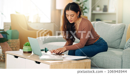 Creative woman working remote with laptop, writing notes or planning business meeting schedule, agenda or research data. Worker or employee with innovation strategy for KPI or SEO report at home. 106948944