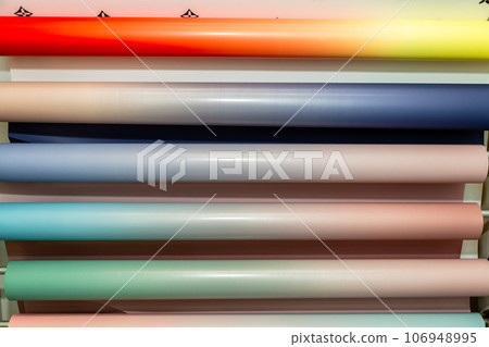 many rolls of wrapping paper or film for gifts and packing bouquets (wallpaper) many rolls of wrapping paper or film for gifts and packing bouquets (wallpaper) 106948995