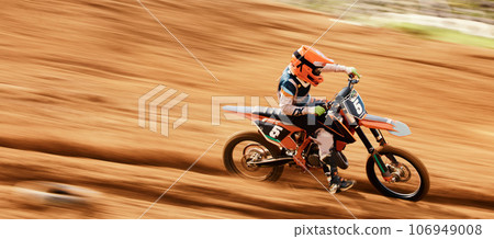 Motorcycle, sand and motion blur with a sports man on space in the desert for dirt biking. Bike, fitness and speed with a person driving fast on an off road course for freedom, power or performance 106949008