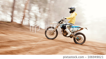 Motorcycle, speed and uphill with a sports man on space in the forest for dirt biking. Bike, fitness and power with a person driving fast on an incline or off road course for freedom or performance Motorcycle, speed and uphill with a sports man on space in the forest for dirt biking. Bike, fitness and power with a person driving fast on an incline or off road course for freedom or performance 106949021