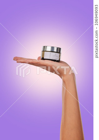 Hand, cream or serum with beauty and skincare, advertising product with dermatology isolated on purple background. Person with cosmetics for skin and promotion, container and facial mask in studio Hand, cream or serum with beauty and skincare, advertising product with dermatology isolated on purple background. Person with cosmetics for skin and promotion, container and facial mask in studio 106949093