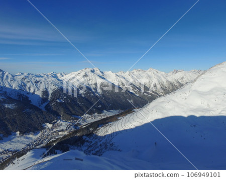 Mountain, snow and nature with environment and blue sky, travel and adventure with winter, Earth and scenery. Arctic, alps and mockup space, ice landscape and snowy land with hiking path and cliff 106949101