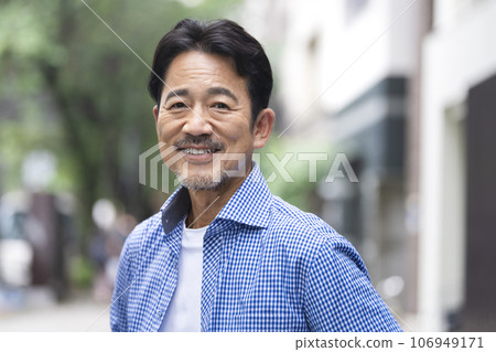 A man in his 50s smiling at the camera 106949171