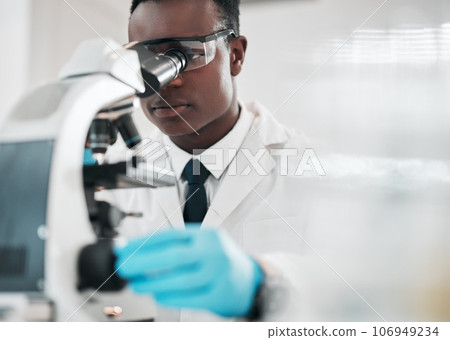 Microscope, black man and chemistry with research, medical and experiment with biotechnology. African person, science and researcher with laboratory equipment, healthcare and check vaccine results Microscope, black man and chemistry with research, medical and experiment with biotechnology. African person, science and researcher with laboratory equipment, healthcare and check vaccine results 106949234